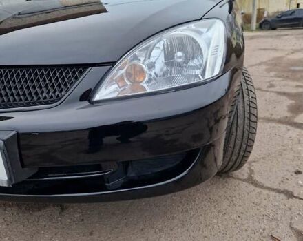 Чорний Міцубісі Lancer, об'ємом двигуна 1.6 л та пробігом 273 тис. км за 3999 $, фото 11 на Automoto.ua