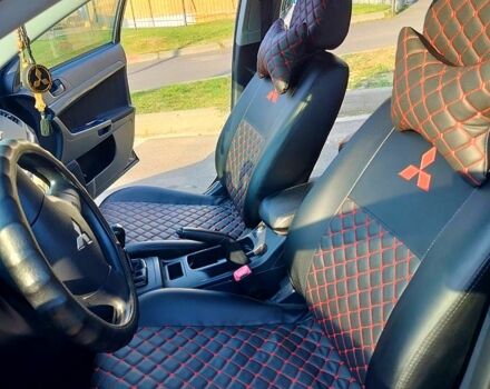 Черный Мицубиси Лансер, объемом двигателя 1.5 л и пробегом 215 тыс. км за 5600 $, фото 8 на Automoto.ua