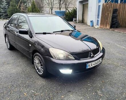 Черный Мицубиси Лансер, объемом двигателя 1.6 л и пробегом 309 тыс. км за 4000 $, фото 1 на Automoto.ua