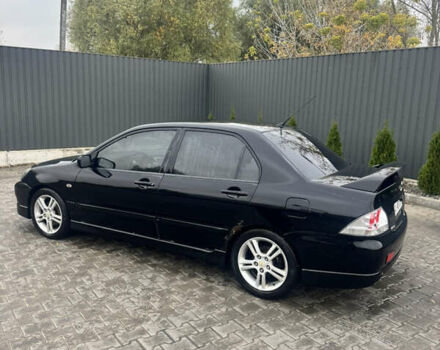 Чорний Міцубісі Lancer, об'ємом двигуна 2 л та пробігом 210 тис. км за 5500 $, фото 2 на Automoto.ua