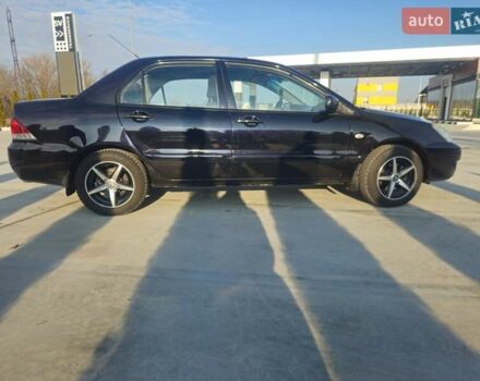 Чорний Міцубісі Lancer, об'ємом двигуна 1.59 л та пробігом 180 тис. км за 4999 $, фото 5 на Automoto.ua