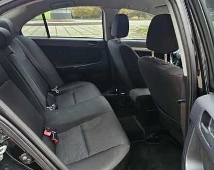 Черный Мицубиси Лансер, объемом двигателя 2 л и пробегом 115 тыс. км за 5000 $, фото 14 на Automoto.ua