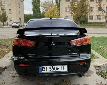 Черный Мицубиси Лансер, объемом двигателя 2 л и пробегом 180 тыс. км за 6100 $, фото 5 на Automoto.ua