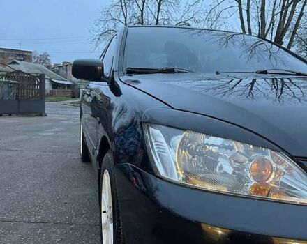 Черный Мицубиси Лансер, объемом двигателя 1.6 л и пробегом 249 тыс. км за 5000 $, фото 7 на Automoto.ua