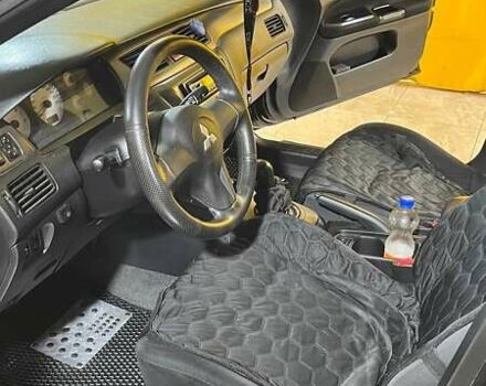 Черный Мицубиси Лансер, объемом двигателя 1.6 л и пробегом 249 тыс. км за 5000 $, фото 12 на Automoto.ua