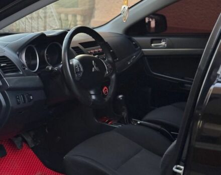 Черный Мицубиси Лансер, объемом двигателя 2 л и пробегом 247 тыс. км за 4700 $, фото 6 на Automoto.ua