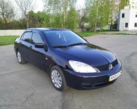 Черный Мицубиси Лансер, объемом двигателя 1.6 л и пробегом 32 тыс. км за 9000 $, фото 6 на Automoto.ua