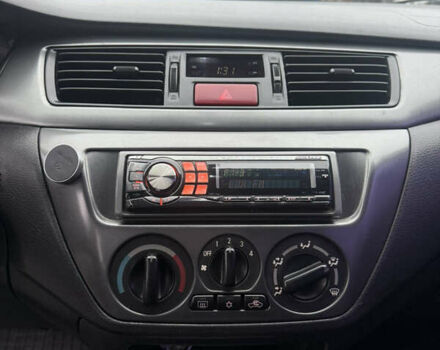 Чорний Міцубісі Lancer, об'ємом двигуна 1.58 л та пробігом 256 тис. км за 3700 $, фото 19 на Automoto.ua