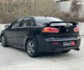 Черный Мицубиси Лансер, объемом двигателя 2 л и пробегом 317 тыс. км за 6990 $, фото 3 на Automoto.ua