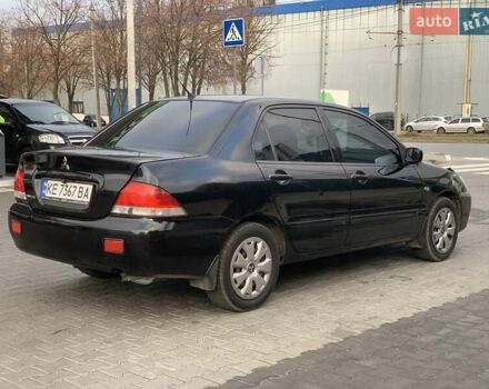 Черный Мицубиси Лансер, объемом двигателя 1.58 л и пробегом 237 тыс. км за 3850 $, фото 3 на Automoto.ua