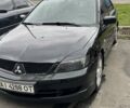 Черный Мицубиси Лансер, объемом двигателя 2 л и пробегом 219 тыс. км за 4400 $, фото 1 на Automoto.ua