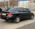 Черный Мицубиси Лансер, объемом двигателя 1.58 л и пробегом 237 тыс. км за 3850 $, фото 3 на Automoto.ua