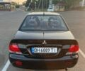 Черный Мицубиси Лансер, объемом двигателя 1.6 л и пробегом 305 тыс. км за 4900 $, фото 2 на Automoto.ua