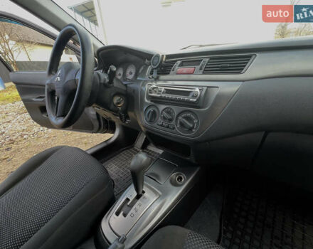 Чорний Міцубісі Lancer, об'ємом двигуна 1.58 л та пробігом 185 тис. км за 3750 $, фото 16 на Automoto.ua