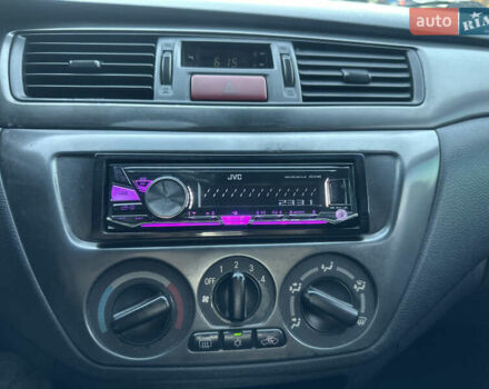 Черный Мицубиси Лансер, объемом двигателя 1.59 л и пробегом 269 тыс. км за 4999 $, фото 9 на Automoto.ua