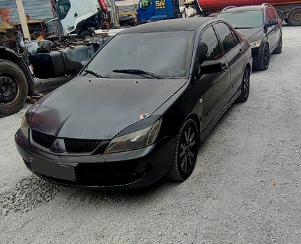 Чорний Міцубісі Lancer, об'ємом двигуна 2 л та пробігом 200 тис. км за 1800 $, фото 3 на Automoto.ua