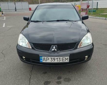 Чорний Міцубісі Lancer, об'ємом двигуна 1.58 л та пробігом 190 тис. км за 3750 $, фото 11 на Automoto.ua