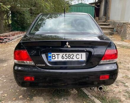 Чорний Міцубісі Lancer, об'ємом двигуна 1.58 л та пробігом 231 тис. км за 4300 $, фото 5 на Automoto.ua