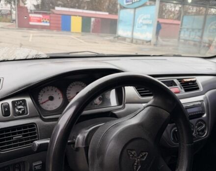 Черный Мицубиси Лансер, объемом двигателя 1.6 л и пробегом 240 тыс. км за 3500 $, фото 4 на Automoto.ua