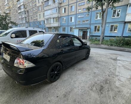 Черный Мицубиси Лансер, объемом двигателя 2 л и пробегом 240 тыс. км за 5600 $, фото 3 на Automoto.ua