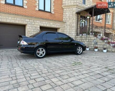 Черный Мицубиси Лансер, объемом двигателя 2 л и пробегом 272 тыс. км за 5514 $, фото 1 на Automoto.ua