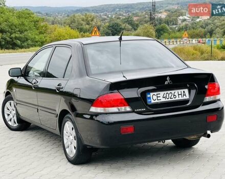 Чорний Міцубісі Lancer, об'ємом двигуна 1.6 л та пробігом 243 тис. км за 4950 $, фото 25 на Automoto.ua
