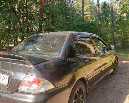 Чорний Міцубісі Lancer, об'ємом двигуна 2 л та пробігом 290 тис. км за 3300 $, фото 2 на Automoto.ua