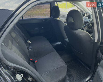 Чорний Міцубісі Lancer, об'ємом двигуна 1.58 л та пробігом 185 тис. км за 3750 $, фото 14 на Automoto.ua
