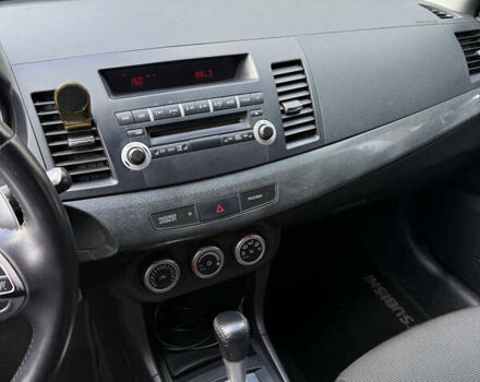 Черный Мицубиси Лансер, объемом двигателя 2 л и пробегом 219 тыс. км за 6400 $, фото 10 на Automoto.ua