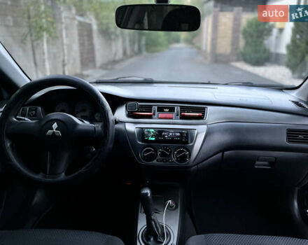 Черный Мицубиси Лансер, объемом двигателя 1.58 л и пробегом 278 тыс. км за 4800 $, фото 12 на Automoto.ua