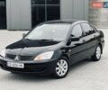 Чорний Міцубісі Lancer, об'ємом двигуна 1.6 л та пробігом 243 тис. км за 4950 $, фото 4 на Automoto.ua