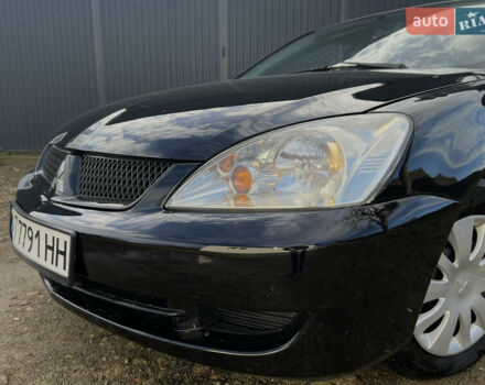 Чорний Міцубісі Lancer, об'ємом двигуна 1.58 л та пробігом 185 тис. км за 3750 $, фото 9 на Automoto.ua