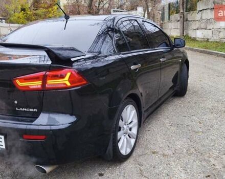 Черный Мицубиси Лансер, объемом двигателя 2 л и пробегом 230 тыс. км за 7100 $, фото 4 на Automoto.ua