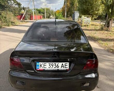 Черный Мицубиси Лансер, объемом двигателя 1.6 л и пробегом 244 тыс. км за 4100 $, фото 1 на Automoto.ua