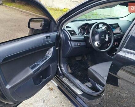 Черный Мицубиси Лансер, объемом двигателя 2 л и пробегом 230 тыс. км за 7100 $, фото 2 на Automoto.ua