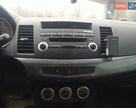 Черный Мицубиси Лансер, объемом двигателя 2 л и пробегом 195 тыс. км за 7899 $, фото 22 на Automoto.ua