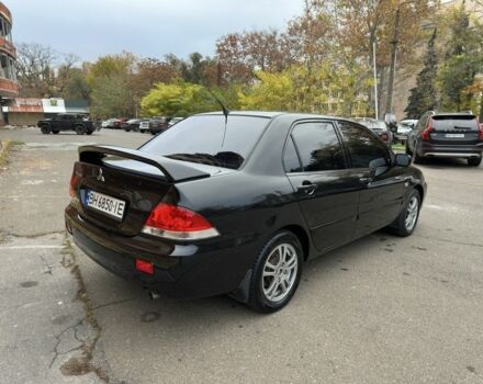 Черный Мицубиси Лансер, объемом двигателя 1.6 л и пробегом 173 тыс. км за 4700 $, фото 4 на Automoto.ua