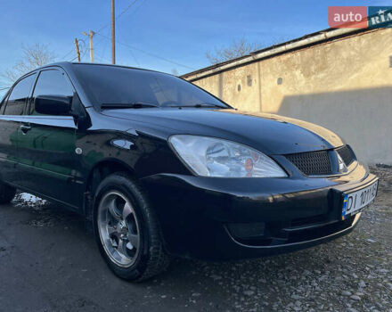 Черный Мицубиси Лансер, объемом двигателя 1.58 л и пробегом 156 тыс. км за 4599 $, фото 13 на Automoto.ua