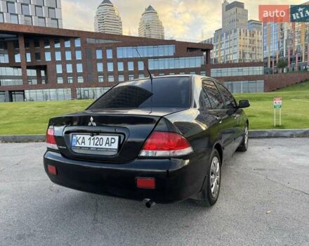 Черный Мицубиси Лансер, объемом двигателя 1.58 л и пробегом 237 тыс. км за 3999 $, фото 11 на Automoto.ua