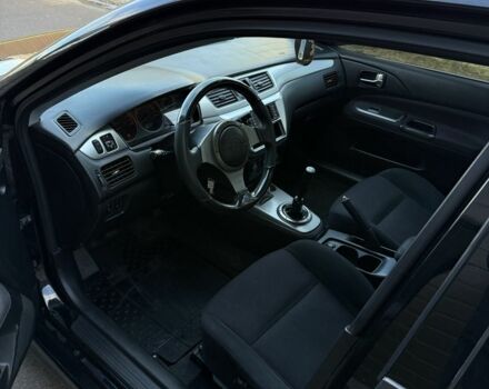 Черный Мицубиси Лансер, объемом двигателя 2 л и пробегом 220 тыс. км за 5250 $, фото 5 на Automoto.ua