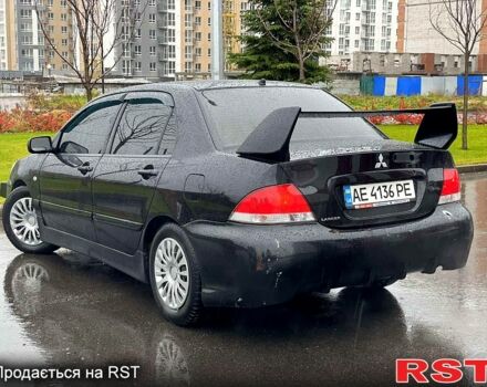 Чорний Міцубісі Lancer, об'ємом двигуна 1.6 л та пробігом 196 тис. км за 3900 $, фото 3 на Automoto.ua