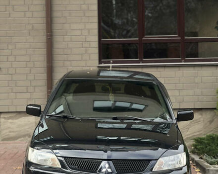 Черный Мицубиси Лансер, объемом двигателя 1.6 л и пробегом 211 тыс. км за 5700 $, фото 6 на Automoto.ua