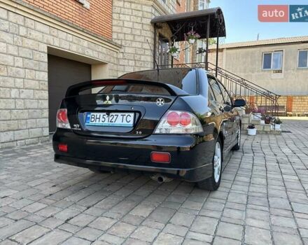 Черный Мицубиси Лансер, объемом двигателя 2 л и пробегом 272 тыс. км за 5514 $, фото 2 на Automoto.ua