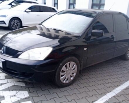 Черный Мицубиси Лансер, объемом двигателя 1.6 л и пробегом 223 тыс. км за 4300 $, фото 6 на Automoto.ua