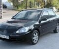 Чорний Міцубісі Lancer, об'ємом двигуна 1.58 л та пробігом 255 тис. км за 3600 $, фото 1 на Automoto.ua