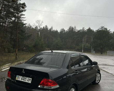 Черный Мицубиси Лансер, объемом двигателя 1.58 л и пробегом 254 тыс. км за 5000 $, фото 4 на Automoto.ua