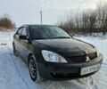 Чорний Міцубісі Lancer, об'ємом двигуна 1.6 л та пробігом 240 тис. км за 3500 $, фото 1 на Automoto.ua