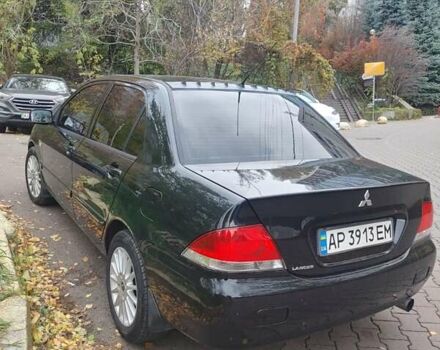 Чорний Міцубісі Lancer, об'ємом двигуна 1.58 л та пробігом 190 тис. км за 3750 $, фото 23 на Automoto.ua