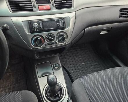 Черный Мицубиси Лансер, объемом двигателя 1.6 л и пробегом 152 тыс. км за 4999 $, фото 8 на Automoto.ua