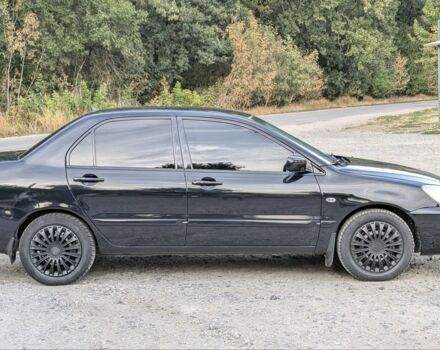 Черный Мицубиси Лансер, объемом двигателя 1.6 л и пробегом 226 тыс. км за 4800 $, фото 4 на Automoto.ua